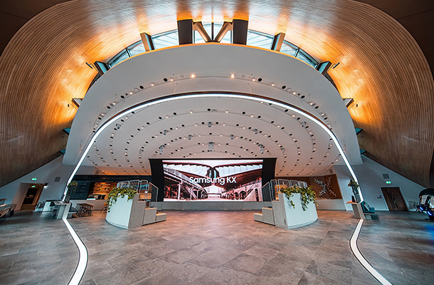 Nulty - Samsung KX, Coal Drops Yard, King's Cross - Architectural Lighting Circular Light Swoop Experience-led Retail Concept Circular Swoop Of Light Samsung KX King's Cross Curved Ceiling Lighting Design Consultants London Nulty