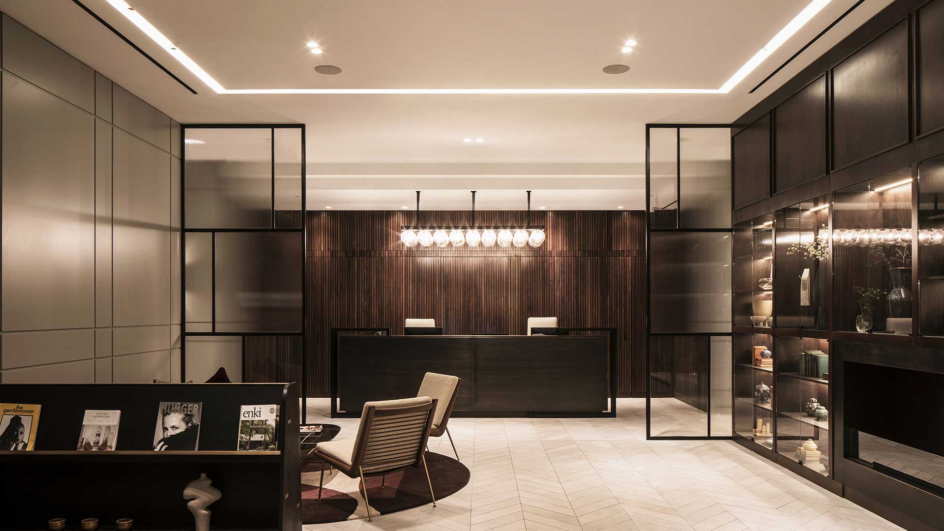 101 on Cleveland Fitzrovia Reception Desk Hospitality Bespoke Pendant Contemporary Cove Interior Lighting Designers Nulty
