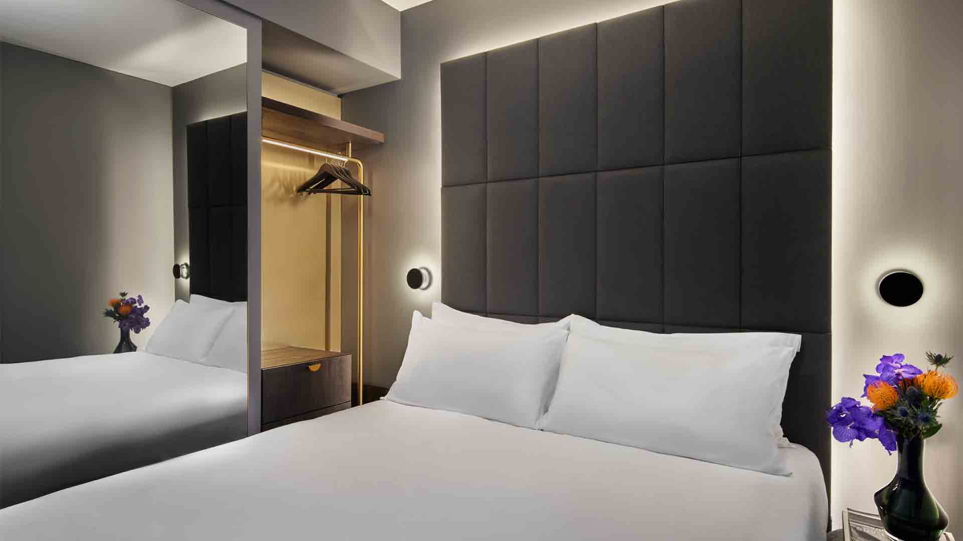Amano Hotel Covent Garden Integrated Linear Glow Layered Illumination Pendants Clean Lines Architectural Lighting Design Consultants Nulty